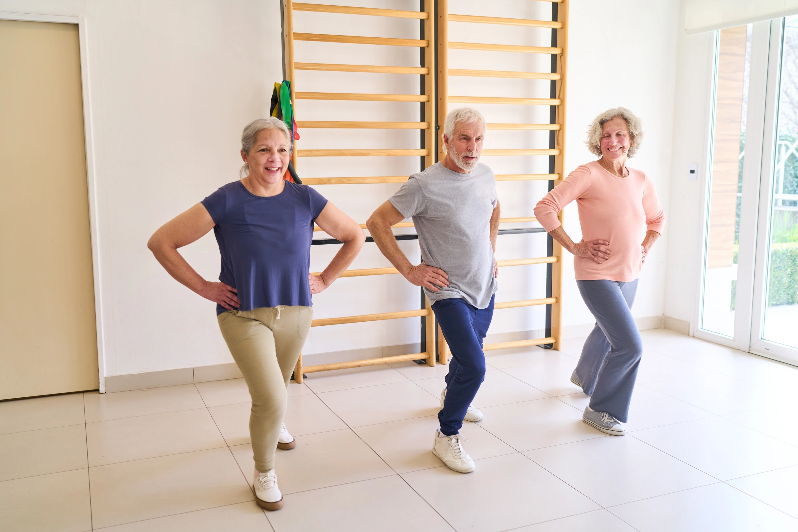 Senior People Doing Lunges Exercise in Rehab Center Elderly Man